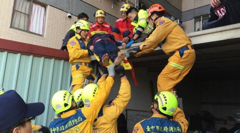 Firefighters rescue woman who fell from high-rise building